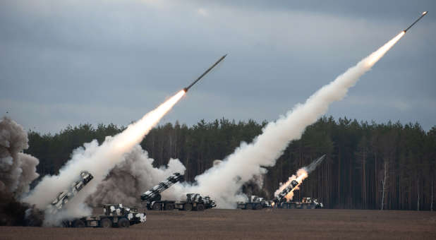 Missile launches in a field.